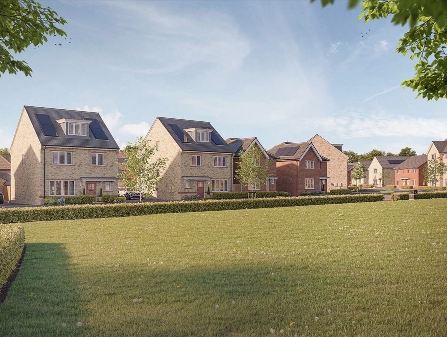 New houses of brick and render looking out over a green